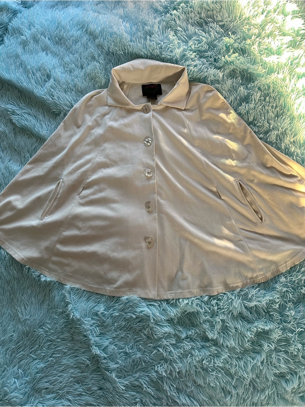 Cream colored cape, holes for arms, slits for belt. XXL. Beautiful buttons.